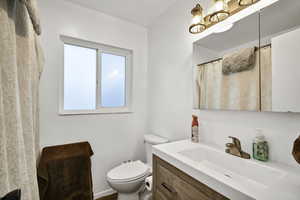 Full bathroom with vanity and shower