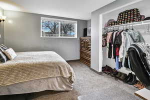 Bedroom featuring a closet and light colored carpet