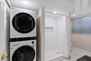 All bathrooms remodeled with floor-to-ceiling tile, new vanities, faucets, lighting, mirrors, flooring, and custom tile showers