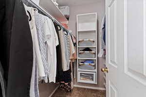 Primary suite offers an updated bathroom and walk-in closet