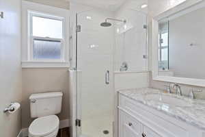 Primary suite offers an updated bathroom and walk-in closet