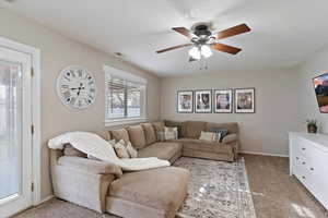 Spacious family room with ceiling fan