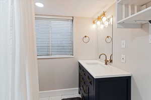 All bathrooms remodeled with floor-to-ceiling tile, new vanities, faucets, lighting, mirrors, flooring, and custom tile showers