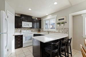 Kitchen features brand-new white quartz countertops & updated cabinetry