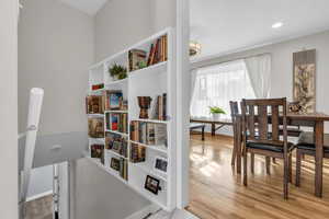 Dining space featuring light wood-type flooring and baseboards