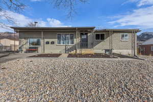 View of front of house featuring brick siding, a porch, and a mountain view