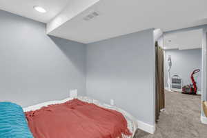 Bedroom featuring recessed lighting and carpet floors