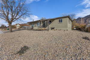 View of front of house with brick siding and a mountain view