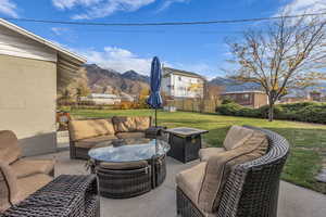 View of patio with an outdoor living space and a mountain view