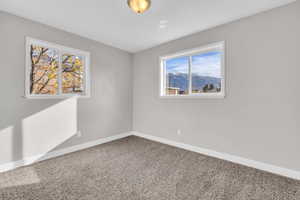 Empty room with a mountain view and carpet