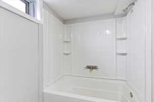 Full bath featuring bathtub / shower combination