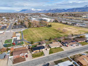 Aerial view of residential area featuring a mountainous background