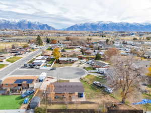Aerial view of residential area featuring a mountainous background