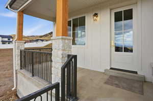 Property entrance featuring a porch and a mountain view