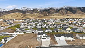 Aerial view of residential area featuring a mountainous background