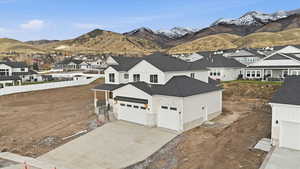 Aerial view of residential area featuring a mountain backdrop