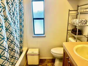 Bathroom with vanity and shower / bath combo