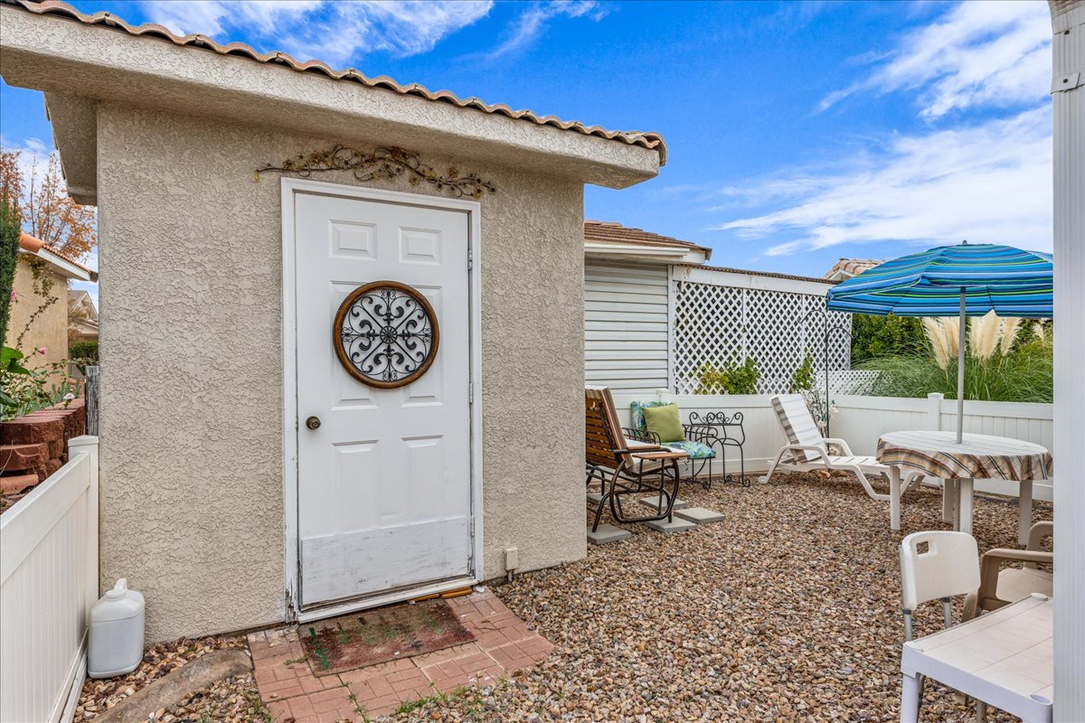 Property entrance featuring stucco siding