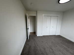 2nd Unfurnished bedroom featuring  carpet and a closet