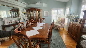 Dining space featuring light wood-style floors and baseboards