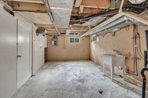 Basement featuring electric panel