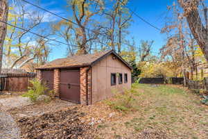 View of shed with a fenced backyard