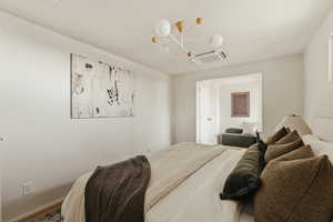 Bedroom featuring cooling unit