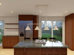 Kitchen with light wood-style floors, open shelves, built in refrigerator, brown cabinets, and recessed lighting