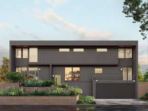 Modern home featuring driveway, a balcony, and a garage