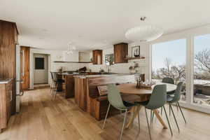 Dining space featuring light wood-type flooring