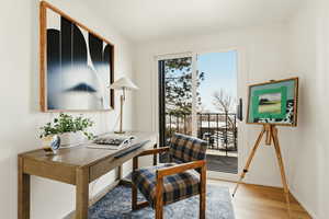 Office area with light wood finished floors and baseboards
