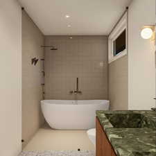 Full bathroom featuring vanity, a freestanding tub, tile walls, recessed lighting, and tiled shower