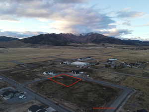 View of rural area with property parcel outlined and a mountainous background