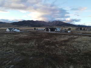 View of mountain background featuring rural landscape