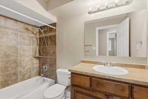 Bathroom featuring shower / bathtub combination and vanity