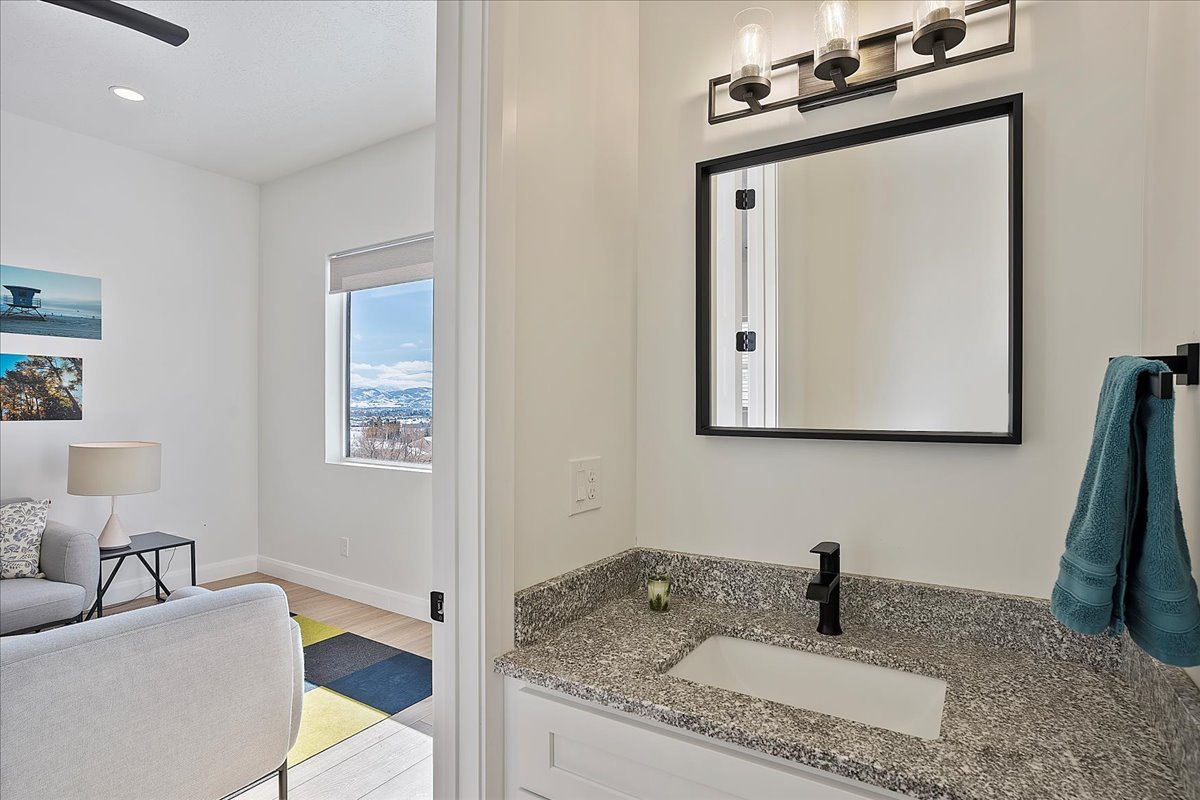 Bathroom with vanity, light wood-style floors, and recessed lighting