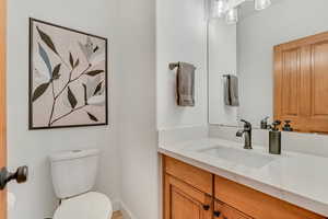 Bathroom featuring vanity and baseboards