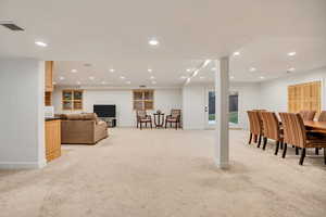 Basement family room with so much space to add a fifth bedroom.