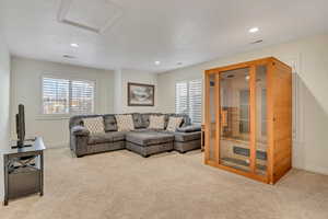 Second Level Family room with a sauna, light colored carpet, recessed lighting, and attic access