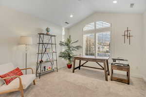 Second Level secondary bedroom with light carpet, vaulted ceiling, and recessed lighting