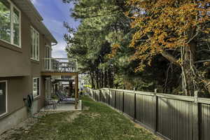 Fenced backyard with a patio area