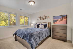 Second Level secondary bedroom featuring baseboards and carpet floors