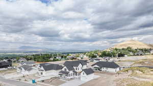 Aerial view of residential area featuring a mountain backdrop