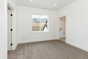 Unfurnished room featuring recessed lighting and light colored carpet