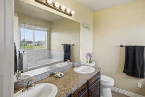 Bathroom with a bath and double vanity
