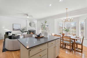 Dining space sits by sunny bay window