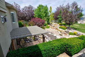 View of yard featuring a patio and a pergola