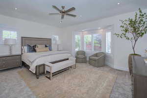 Bedroom featuring light colored carpet, a ceiling fan, and recessed lighting
