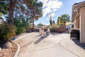 Fenced backyard with a patio, area for grilling, and outdoor dining area