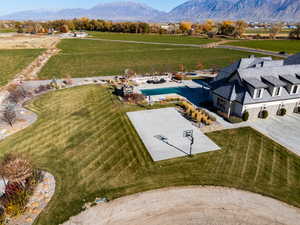 Overview of rural landscape featuring mountains and a pool area